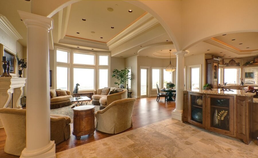 An open living space featuring in-ceiling speakers.