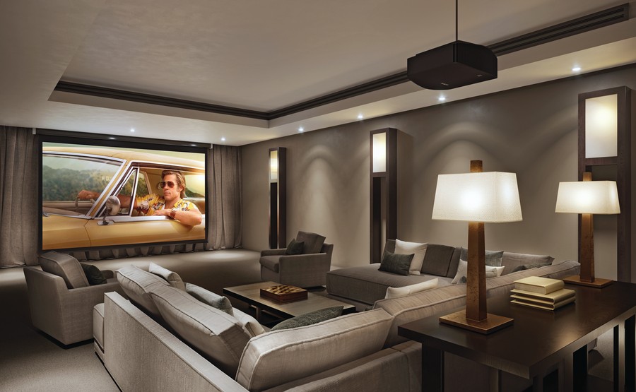 Sony projector displaying a Brad Pitt film on a large projection screen in a luxury home theater