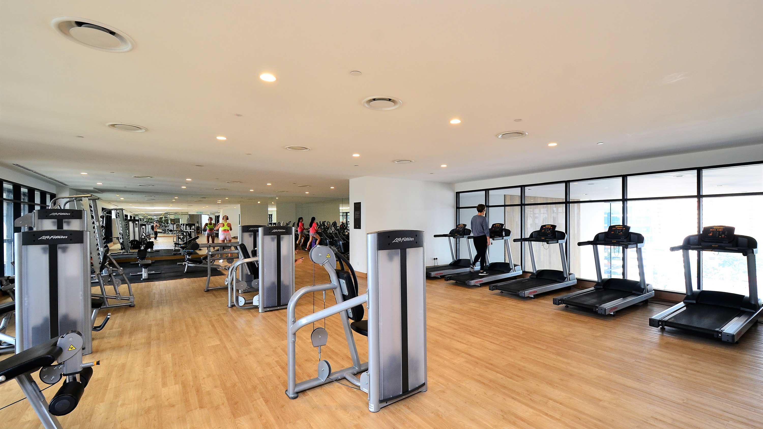 commercial gym with wall windows