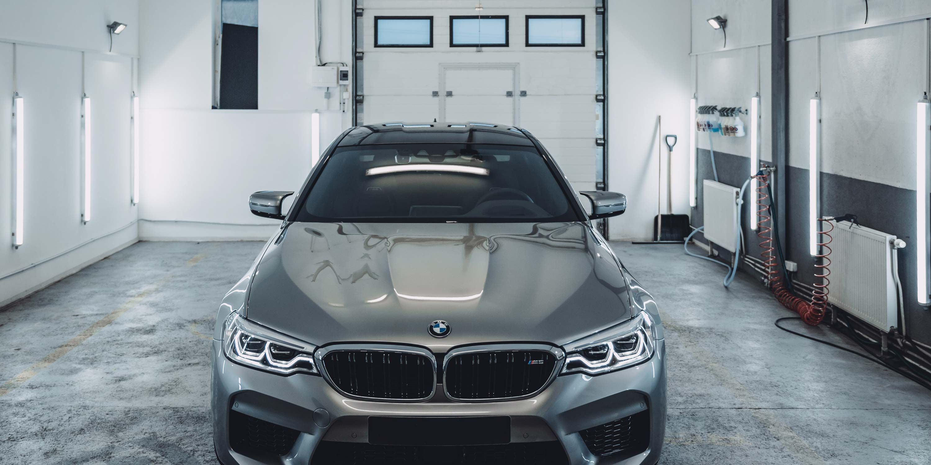 garage with silver BMW in the garage